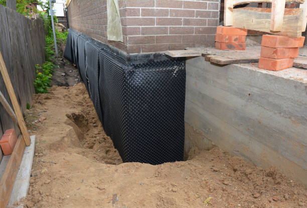 SJ Waterproofing Pros technician performing targeted Interior Drainage System assessment in Beaverton, MI